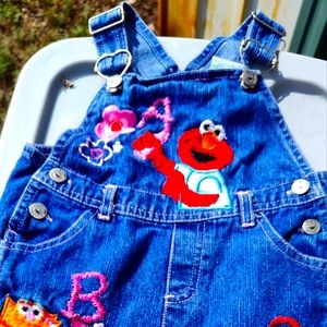 Sesame Street alphabet and denim overalls snap legs an adjustable shoulder strap